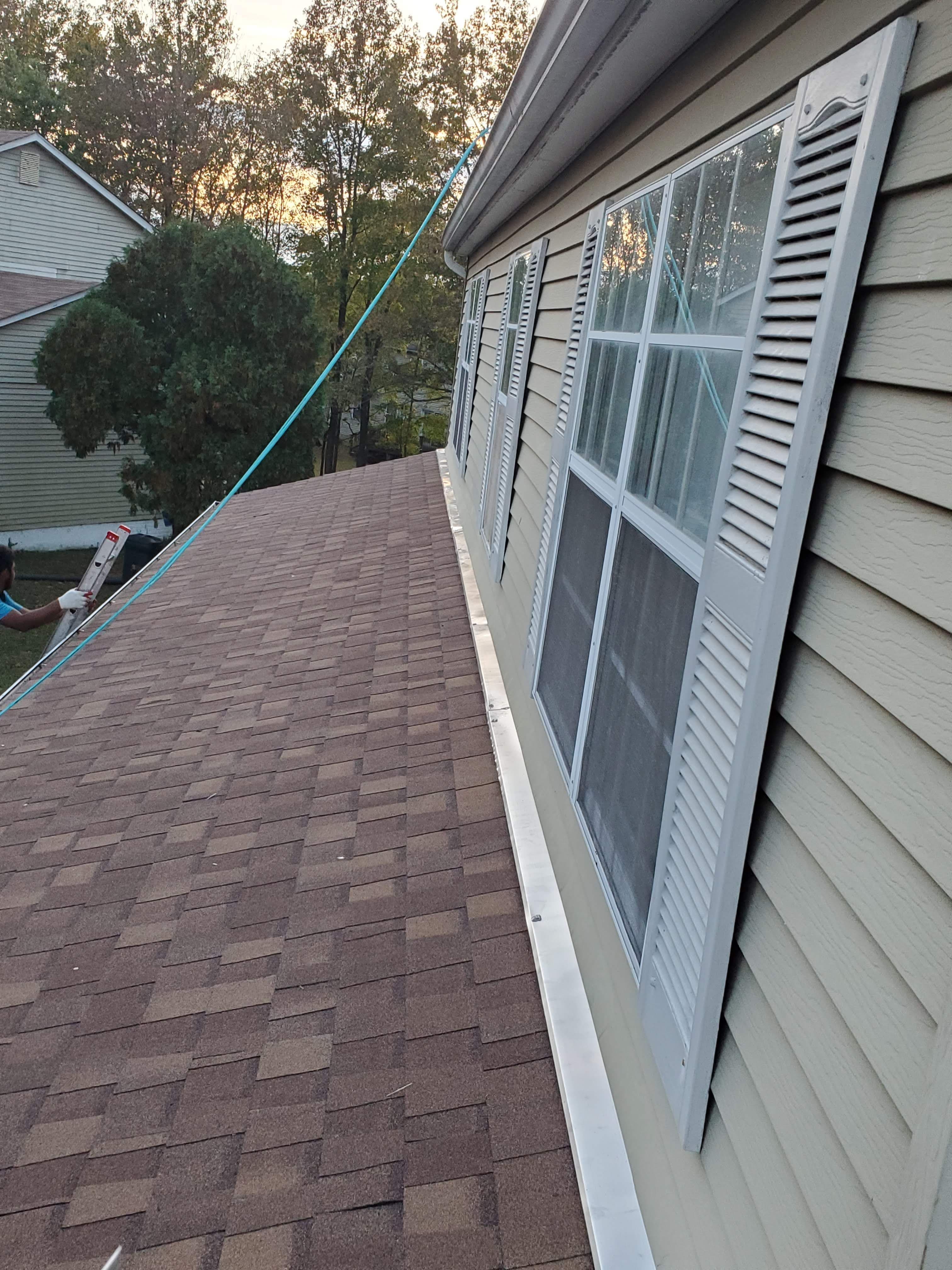 Completed dormer addition with new roofing, window, siding, and flashing on a Maryland home