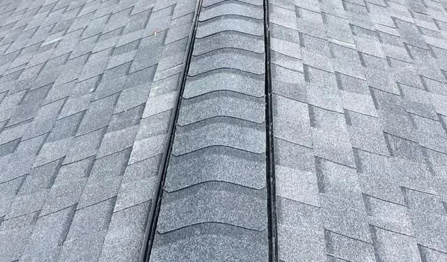 Asphalt shingle roof with continuous ridge vent installed by Apper Construction on a Severna Park Maryland home